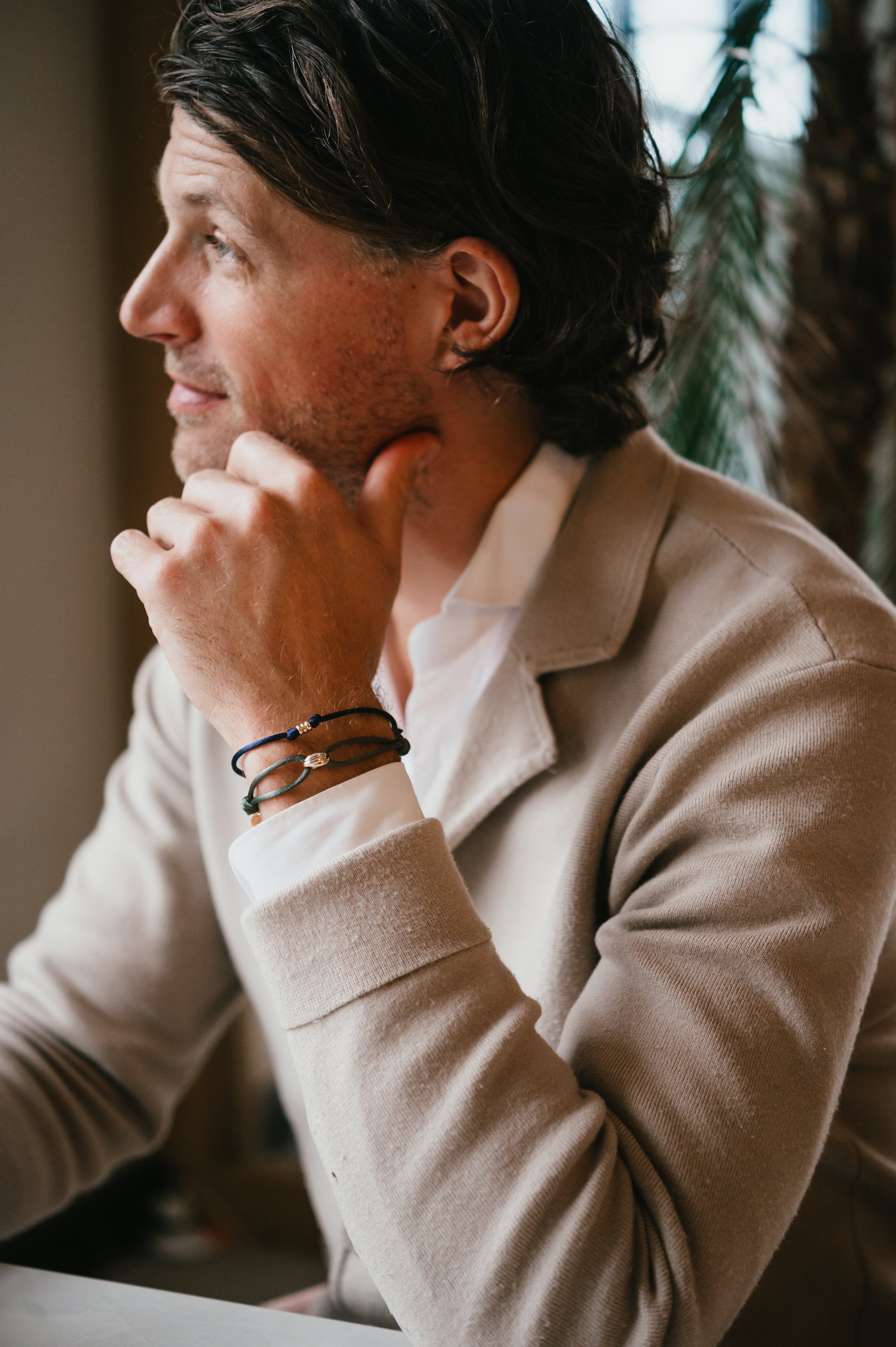 man with tricolor bracelet